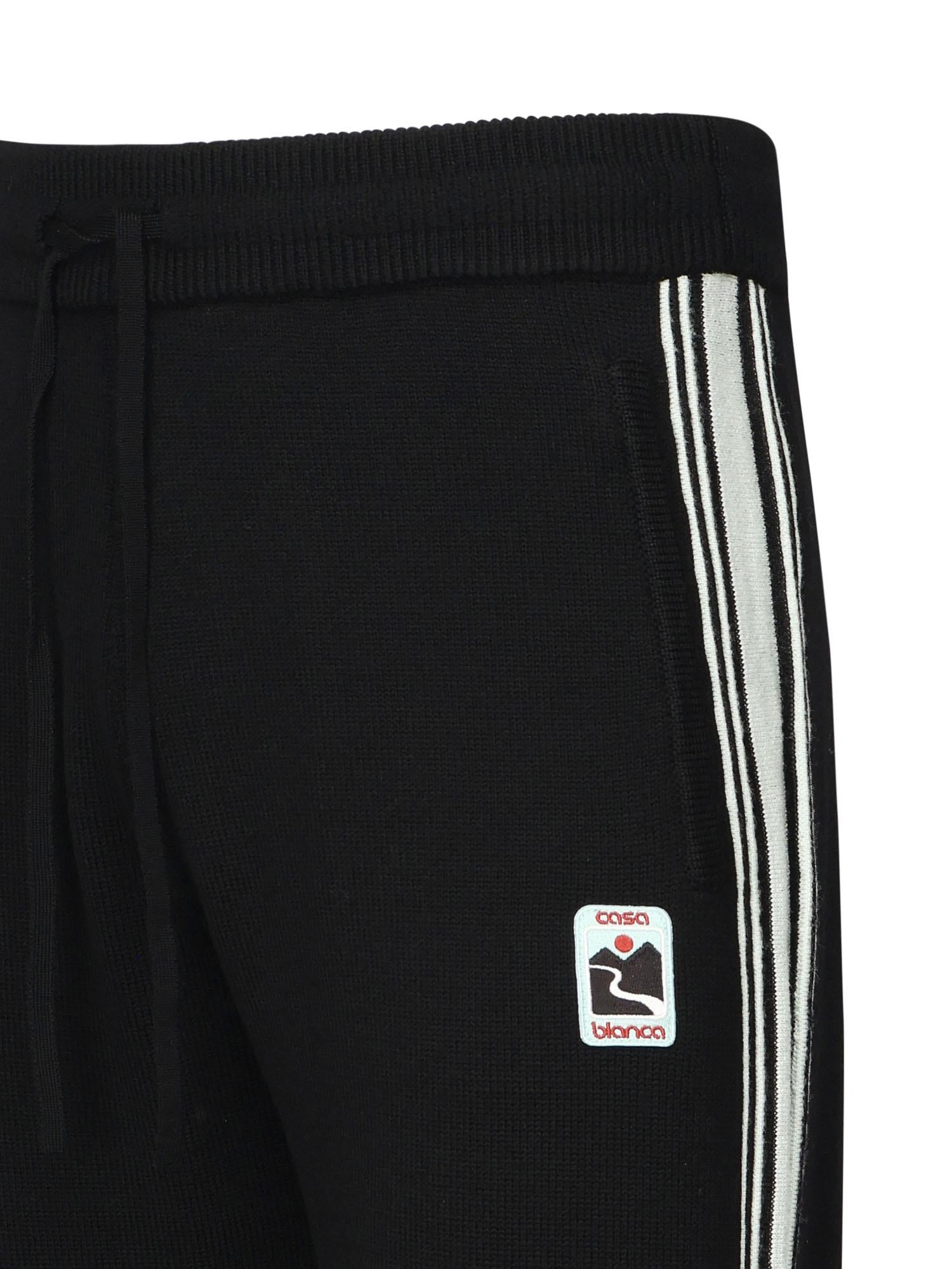 Pantaloni in lana con logo<BR/> MPF25KW101201 CASABLANCA