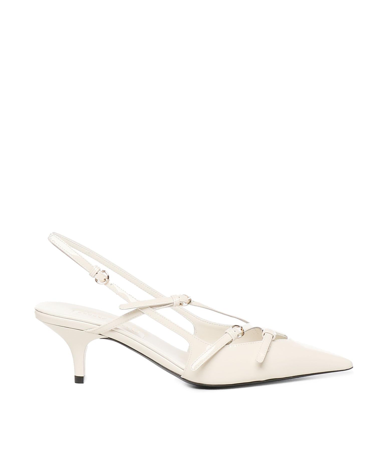 Décolleté slingback in vernice con fibbie 5I013E 69F0304 MIU MIU 